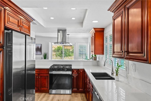 710 S Tourmaline Ct, Anaheim Hills, CA 92807 - kitchen featuring appliances with stainless steel finishes, ventilation hood, light countertops, and recessed lighting