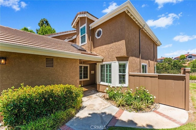 710 S Tourmaline Ct, Anaheim Hills, CA 92807 - property entrance featuring stucco siding and a tiled roof