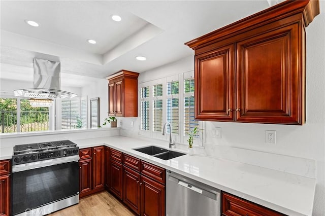 710 S Tourmaline Ct, Anaheim Hills, CA 92807 - kitchen featuring appliances with stainless steel finishes, island range hood, reddish brown cabinets, plenty of natural light, and recessed lighting