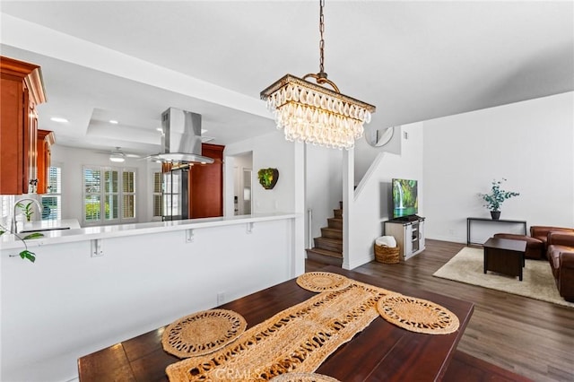 710 S Tourmaline Ct, Anaheim Hills, CA 92807 - dining area featuring a chandelier, dark wood finished floors, stairway, and recessed lighting