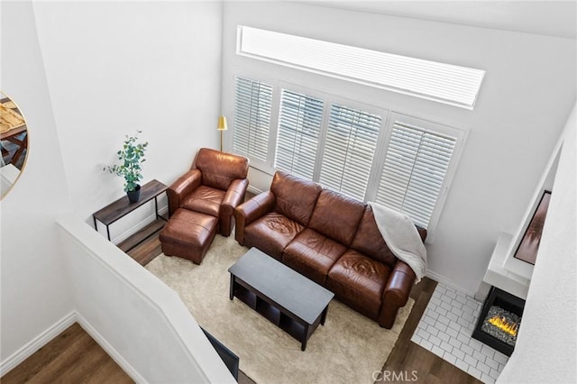 710 S Tourmaline Ct, Anaheim Hills, CA 92807 - living room with wood finished floors and a warm lit fireplace