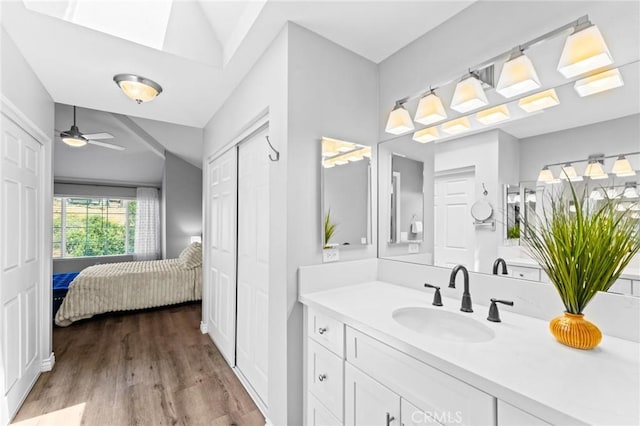 710 S Tourmaline Ct, Anaheim Hills, CA 92807 - bathroom featuring vanity, wood finished floors, connected bathroom, and a ceiling fan