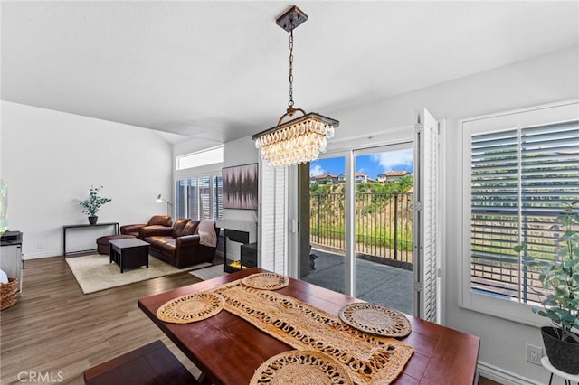 710 S Tourmaline Ct, Anaheim Hills, CA 92807 - dining room featuring plenty of natural light, a chandelier, and wood finished floors