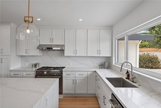 8 Clipper Rd, Rancho Palos Verdes, CA 90275 - kitchen featuring appliances with stainless steel finishes, under cabinet range hood, white cabinets, decorative light fixtures, and recessed lighting