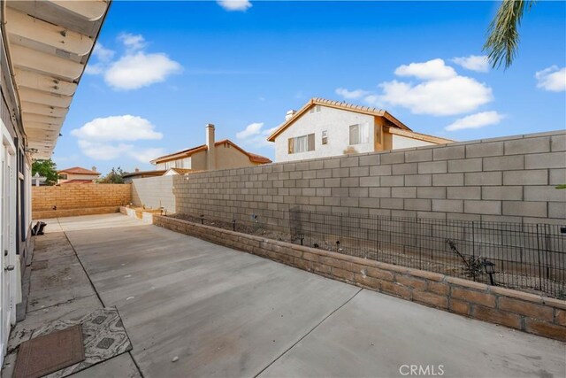 37908 52nd St E, Palmdale, CA 93552 - fenced backyard with a patio