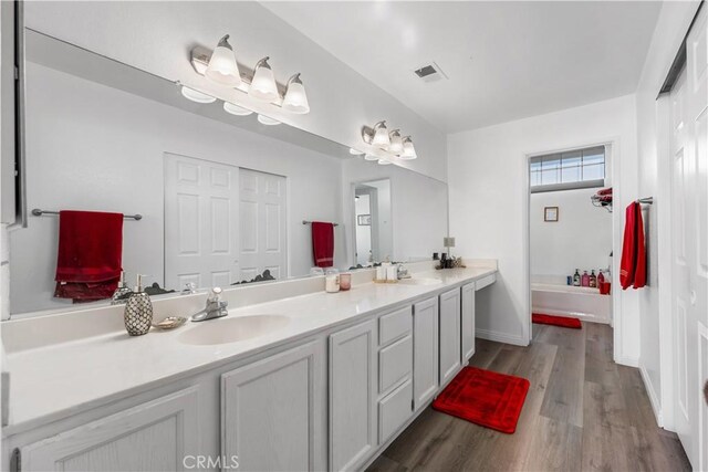 37908 52nd St E, Palmdale, CA 93552 - bathroom with double vanity and wood finished floors