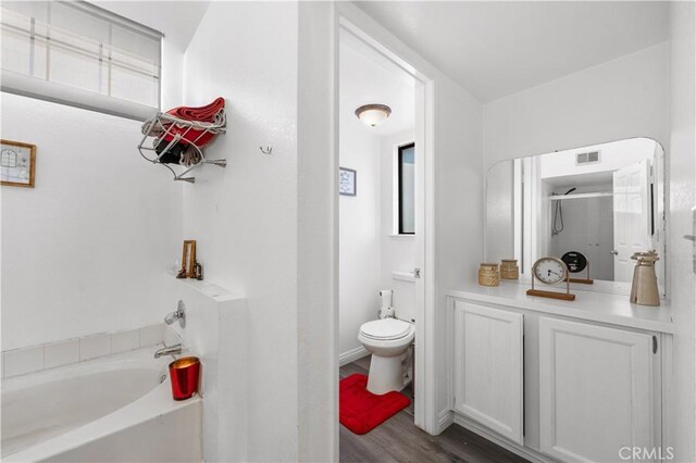 37908 52nd St E, Palmdale, CA 93552 - bathroom with a bath, wood finished floors, and a shower