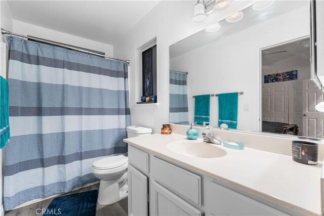 37908 52nd St E, Palmdale, CA 93552 - bathroom with vanity, wood finished floors, and a shower with curtain