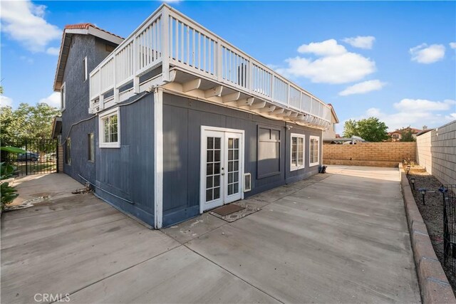 37908 52nd St E, Palmdale, CA 93552 - back of house featuring a patio, a fenced backyard, and french doors