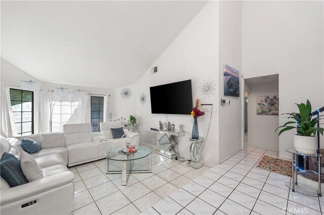 37908 52nd St E, Palmdale, CA 93552 - living area with high vaulted ceiling and light tile patterned floors