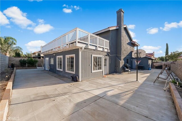 37908 52nd St E, Palmdale, CA 93552 - rear view of house featuring a patio area and a chimney