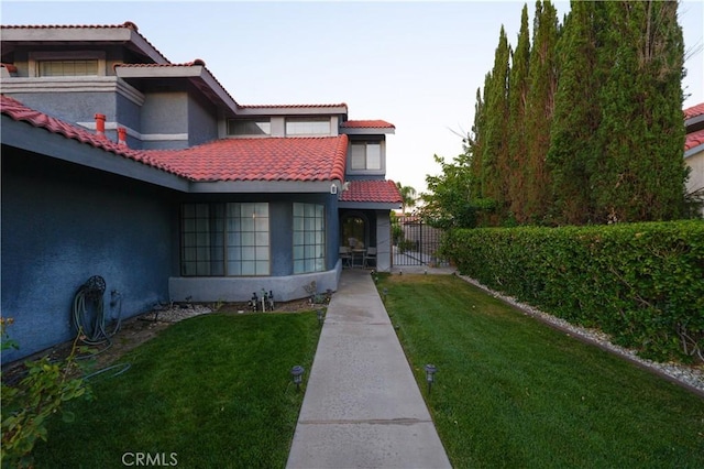 37908 52nd St E, Palmdale, CA 93552 - view of front of home featuring stucco siding and a tile roof