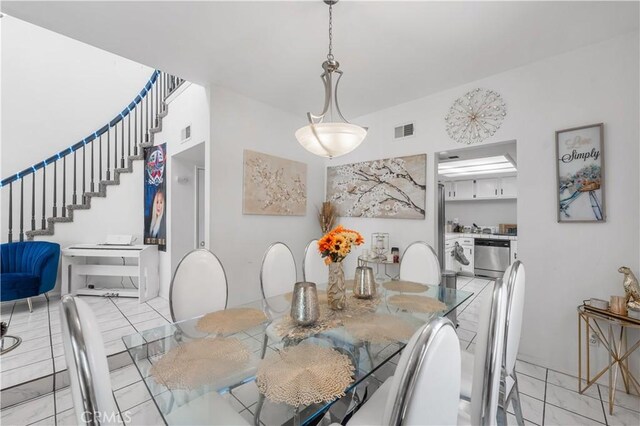 37908 52nd St E, Palmdale, CA 93552 - dining room with stairway and marble finish flooring