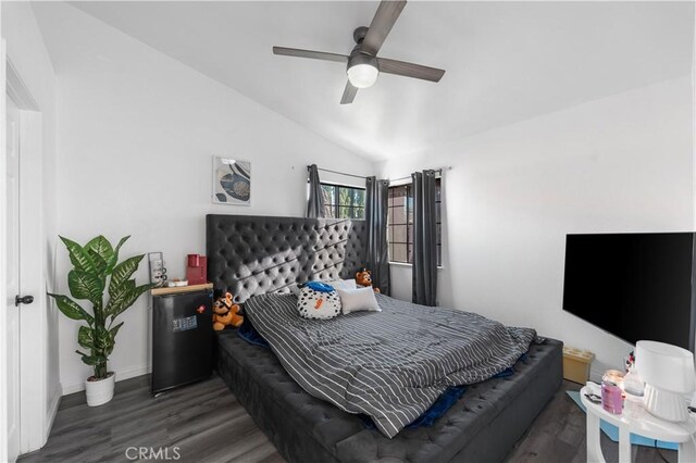 37908 52nd St E, Palmdale, CA 93552 - bedroom with wood finished floors, vaulted ceiling, and a ceiling fan