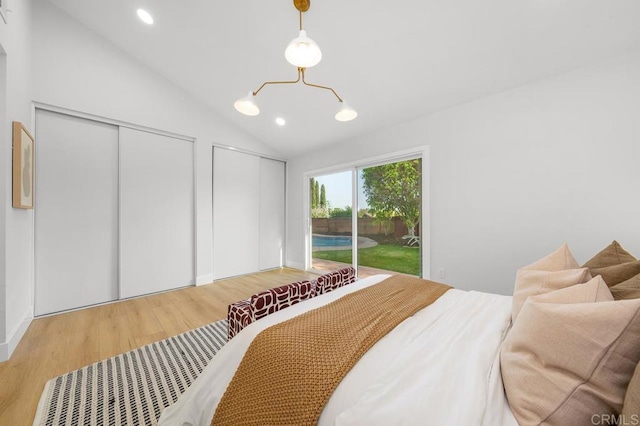 10437 Hermanos Rd, San Diego, CA 92124 - bedroom featuring access to outside, wood finished floors, multiple closets, vaulted ceiling, and recessed lighting