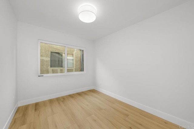 10437 Hermanos Rd, San Diego, CA 92124 - unfurnished room with light wood-type flooring and baseboards