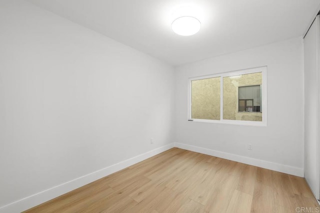 10437 Hermanos Rd, San Diego, CA 92124 - unfurnished room featuring baseboards and light wood-type flooring