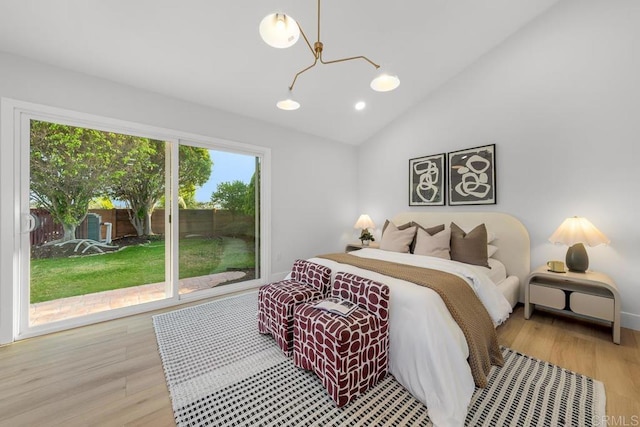 10437 Hermanos Rd, San Diego, CA 92124 - bedroom featuring access to outside, a chandelier, wood finished floors, vaulted ceiling, and recessed lighting