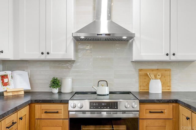 10437 Hermanos Rd, San Diego, CA 92124 - kitchen featuring stainless steel electric stove, wall chimney exhaust hood, backsplash, and white cabinetry