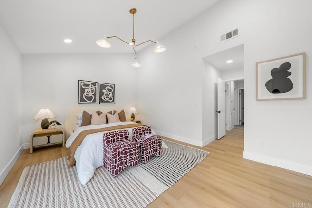 10437 Hermanos Rd, San Diego, CA 92124 - bedroom with wood finished floors, high vaulted ceiling, and recessed lighting