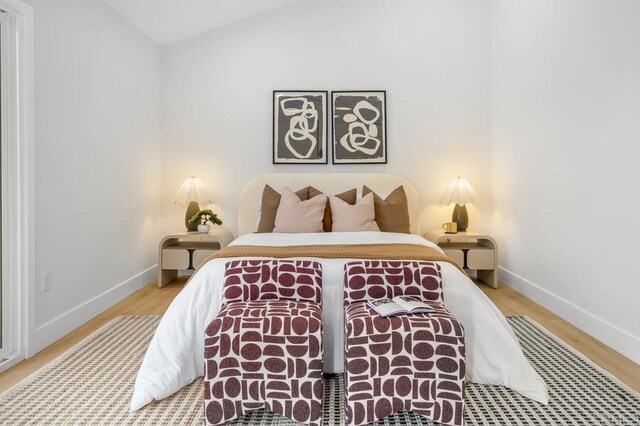 10437 Hermanos Rd, San Diego, CA 92124 - bedroom featuring vaulted ceiling and wood finished floors