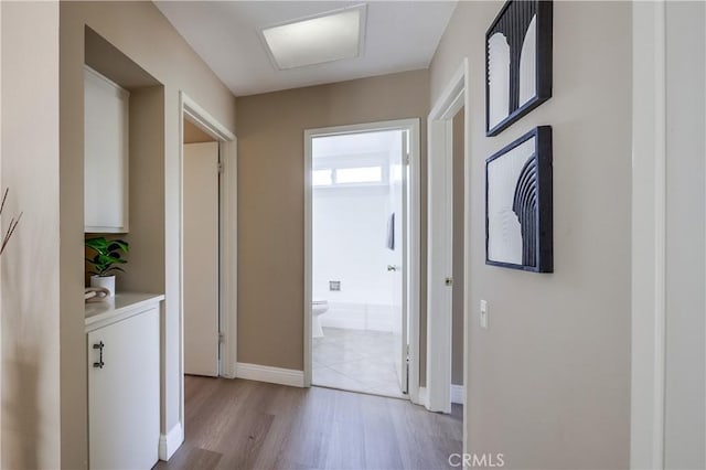 24482 Chrisanta Dr, Mission Viejo, CA 92691 - corridor with light wood-style floors and baseboards