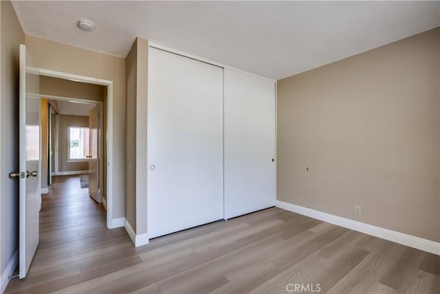24482 Chrisanta Dr, Mission Viejo, CA 92691 - unfurnished bedroom featuring wood finished floors and a closet