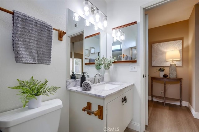 24482 Chrisanta Dr, Mission Viejo, CA 92691 - half bathroom featuring wood finished floors and vanity