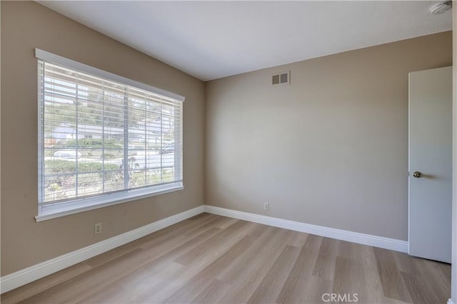 24482 Chrisanta Dr, Mission Viejo, CA 92691 - unfurnished room featuring light wood-style floors and a smoke detector