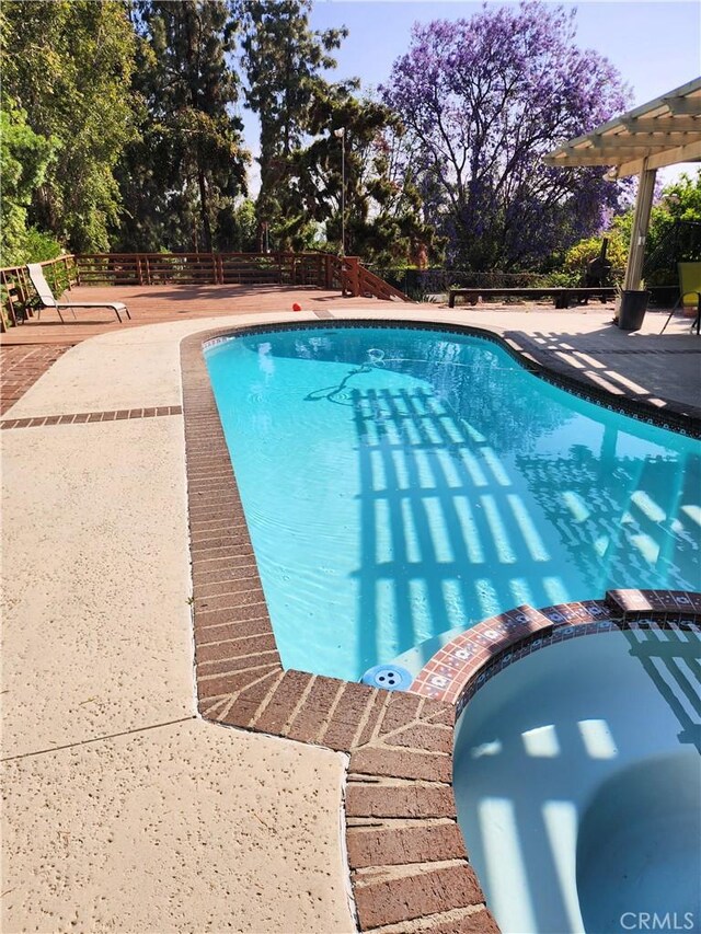 10771 Orchard View Ln, Riverside, CA 92503 - view of pool with a patio, a fenced backyard, a pool with connected hot tub, and view of scattered trees