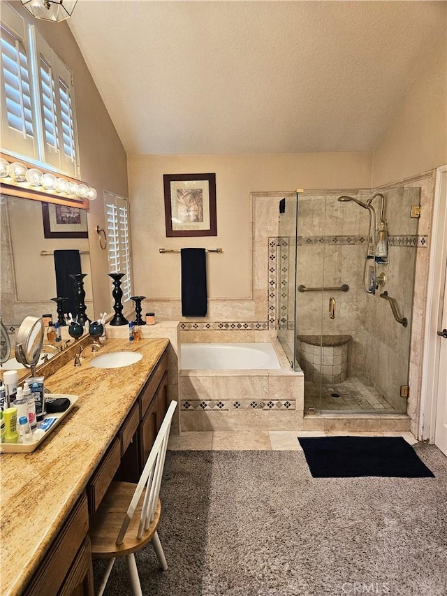 10771 Orchard View Ln, Riverside, CA 92503 - bathroom with lofted ceiling, a bath, a shower stall, vanity, and a textured ceiling