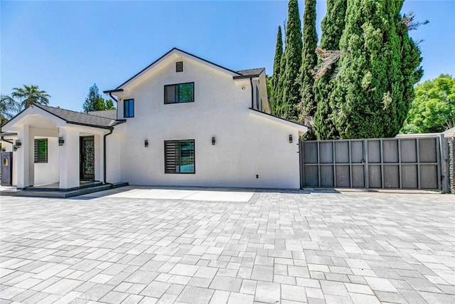 17800 Raymer St, Sherwood Forest, CA 91325 - view of front facade featuring stucco siding and a patio area