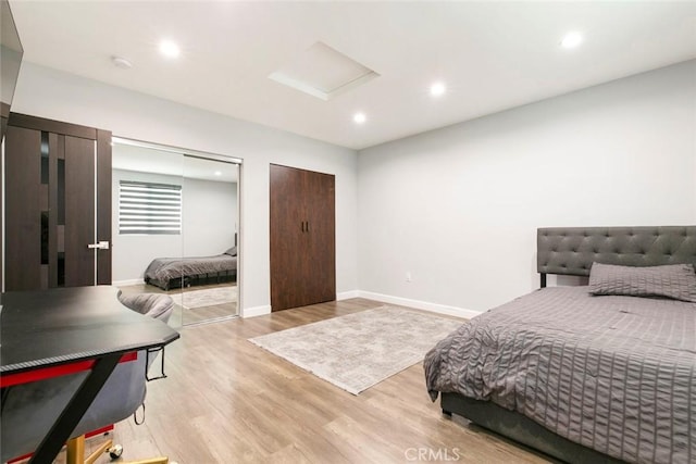 17800 Raymer St, Sherwood Forest, CA 91325 - bedroom featuring attic access, light wood finished floors, multiple closets, and recessed lighting