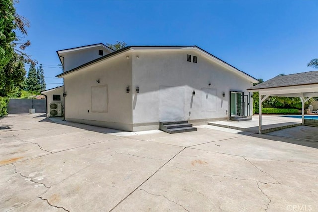 17800 Raymer St, Sherwood Forest, CA 91325 - back of property featuring a patio area, entry steps, and stucco siding
