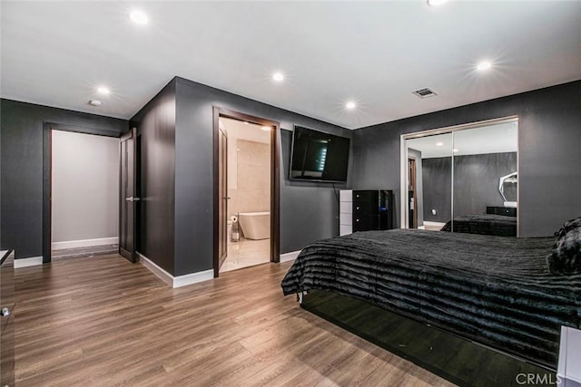 17800 Raymer St, Sherwood Forest, CA 91325 - bedroom featuring wood finished floors, recessed lighting, a closet, and ensuite bath