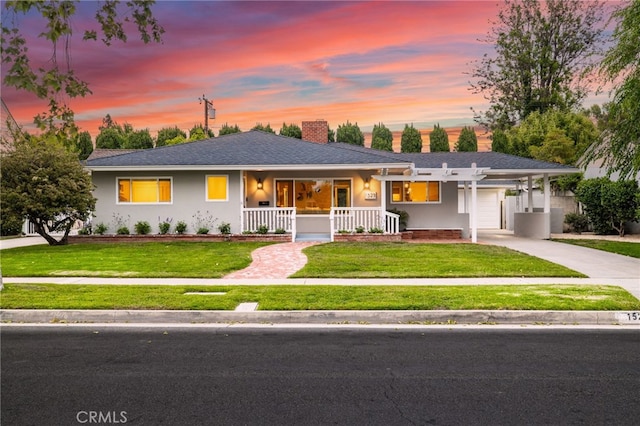1523 Freeman St, Santa Ana, CA 92706 - ranch-style house with a porch, concrete driveway, a front yard, a chimney, and an attached carport