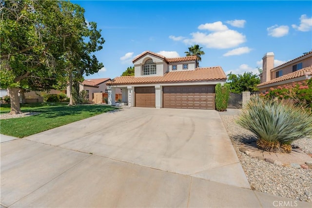37921 Tackstem St, Palmdale, CA 93552 - mediterranean / spanish home with a tile roof, stucco siding, driveway, a gate, and a garage