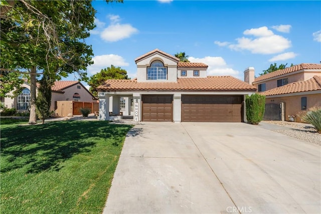 37921 Tackstem St, Palmdale, CA 93552 - mediterranean / spanish-style home with stucco siding, concrete driveway, a tiled roof, and a garage