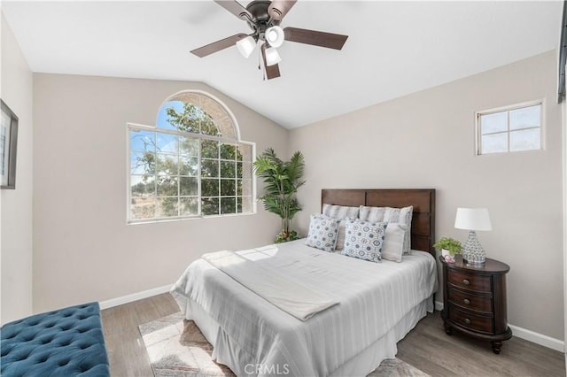 37921 Tackstem St, Palmdale, CA 93552 - bedroom featuring multiple windows, wood finished floors, vaulted ceiling, and a ceiling fan