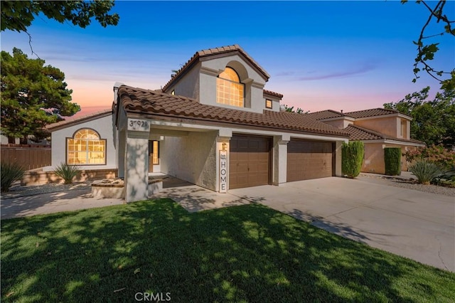 37921 Tackstem St, Palmdale, CA 93552 - mediterranean / spanish house with concrete driveway, stucco siding, and a garage
