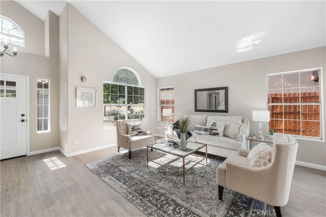 37921 Tackstem St, Palmdale, CA 93552 - living area featuring high vaulted ceiling, wood finished floors, and healthy amount of natural light