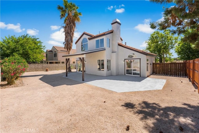 37921 Tackstem St, Palmdale, CA 93552 - rear view of property with a chimney, stucco siding, a fenced backyard, and a patio