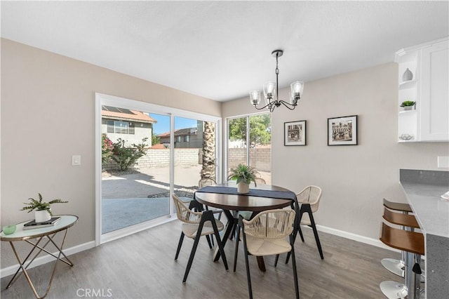 37921 Tackstem St, Palmdale, CA 93552 - dining area with a chandelier and wood finished floors