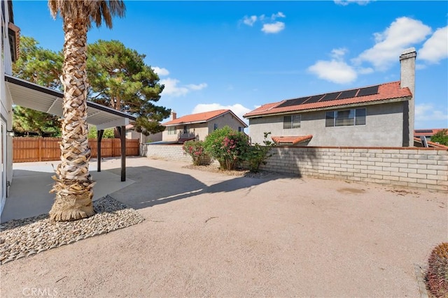 37921 Tackstem St, Palmdale, CA 93552 - view of front of home with a chimney, a patio area, and stucco siding