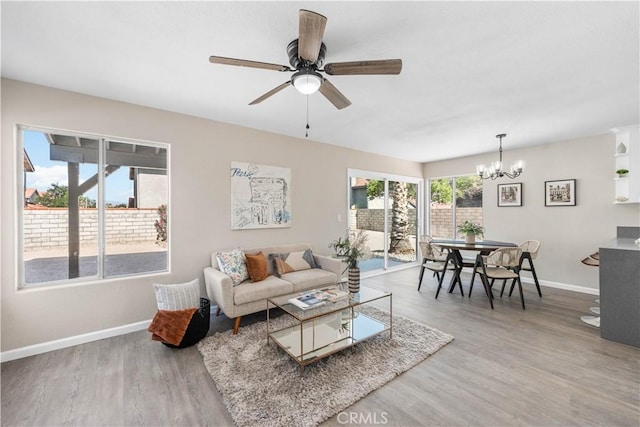 37921 Tackstem St, Palmdale, CA 93552 - living room with a chandelier, wood finished floors, and ceiling fan