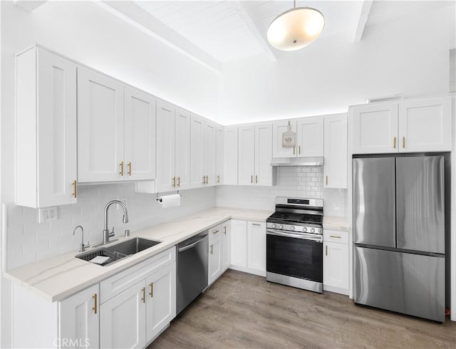 7924 Woodman Ave Unit 20, Panorama City, CA 91402 - kitchen with stainless steel appliances, tasteful backsplash, and light stone counters