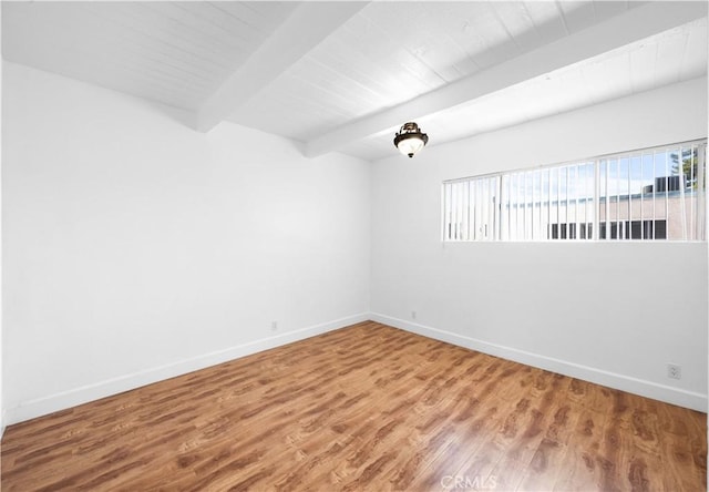 7924 Woodman Ave Unit 20, Panorama City, CA 91402 - unfurnished room featuring wood finished floors and a wood ceiling with exposed beams