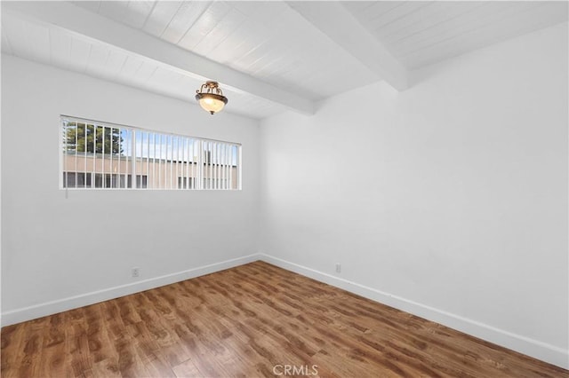 7924 Woodman Ave Unit 20, Panorama City, CA 91402 - spare room featuring wood finished floors and a wood ceiling with exposed beams
