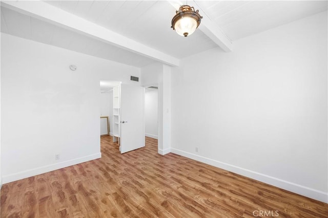 7924 Woodman Ave Unit 20, Panorama City, CA 91402 - empty room featuring beamed ceiling and wood finished floors