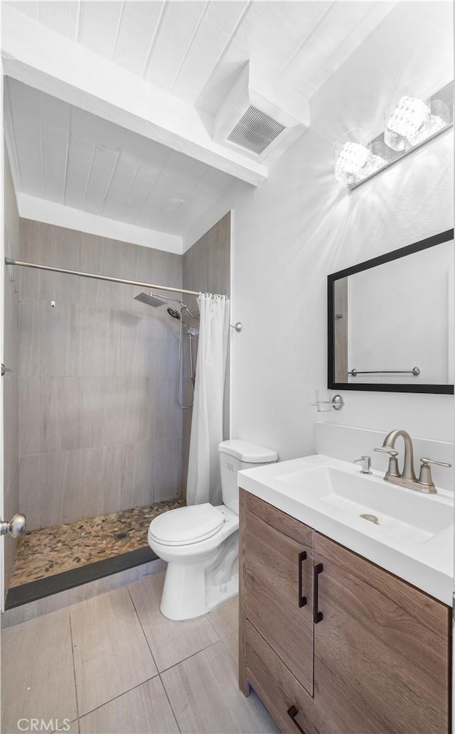 7924 Woodman Ave Unit 20, Panorama City, CA 91402 - full bathroom with vanity, a tile shower, beamed ceiling, and wood finished floors